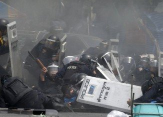 Clashes erupted in central Bangkok on Tuesday with several protesters and police officers injured