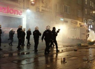 Demonstrators threw fireworks and stones at police cordoning off Taksim Square