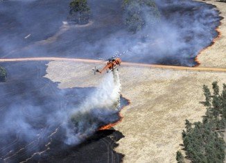 Dozens of bushfires are sweeping the Australian states of Victoria, South Australia and New South Wales, fanned by hot weather and strong winds