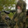 Si Robertson gets stuck in a marsh during paintball match