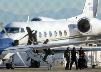Justin Bieber was allowed to re-enter the US Friday after a brief detention when customs officials used drug-sniffing dogs to search his private jet