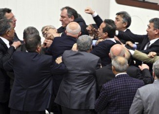 Turkish lawmakers have approved controversial plans to reform the country's top judicial body, amid a brawl which left one opposition legislator with a broken nose