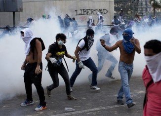 Venezuela’s police and National Guard have used tear gas to break up a student demonstration in Caracas