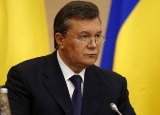 Viktor Yanukovych has made his first public appearance since being removed from office at a news conference in Russia