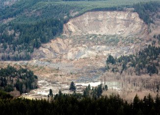 Eight bodies have been recovered so far after the 177ft deep wall of mud swept near the town of Oso