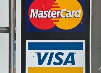 MasterCard and Visa have decided to block credit card services to some Russian bank customers as a result of US sanctions