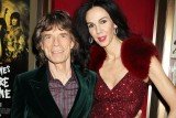 Mick Jagger is "struggling" to understand the death of his girlfriend L'Wren Scott