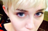 Miley Cyrus showed off her new sad cat Emoji lip tattoo