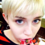 Miley Cyrus shows off new sad cat Emoji lip tattoo. Is it fake or permanent?