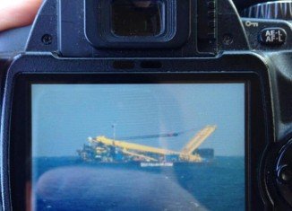 The tug boat ferrying a large object at sea has been mistaken for a crashed plane off the Spanish Island of Gran Canaria
