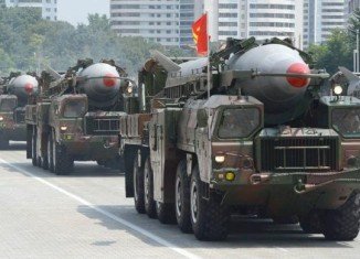 Two medium-range ballistic missiles have been test-fired by North Korea, just hours after the US, South Korea and Japan met in the Netherlands for talks