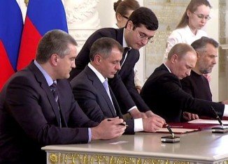 Vladimir Putin and Crimean leaders signs treaty to incorporate the peninsula into Russia