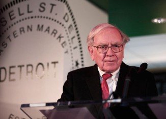 Warren Buffett’s investment company Berkshire Hathaway has reported a record $19.5 billion profit for 2013