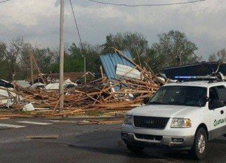 At least 12 people have been killed by tornadoes in Arkansas and Oklahoma as a huge storm system swept across America’s midsection