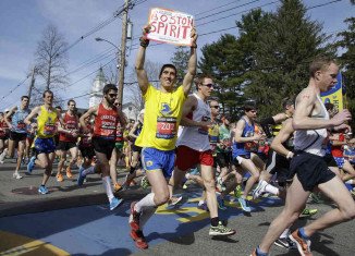 Boston honored three killed and more than 260 injured in the last year's bomb attack as thousands of marathoners took to the city’s streets