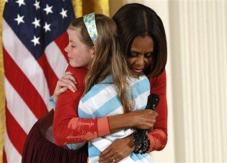 Michelle Obama invited Charlotte Bell on stage and gave her a hug