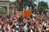 Narendra Modi arrived in the holy city of Varanasi as supporters from BJP poured onto the streets