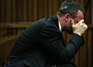 Oscar Pistorius has said he was "besotted" with his girlfriend Reeva Steenkamp, as he gave evidence at his murder trial