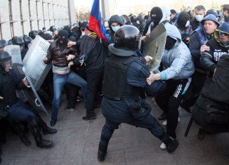 Pro-Russian protesters clashed with police, waved Russian flags and called for a referendum on independence from Ukraine