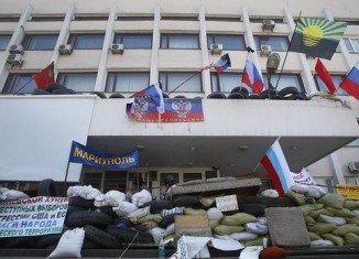 Ukraine’s government announces it has regained control of the city hall in the eastern port of Mariupol from pro-Russian separatists