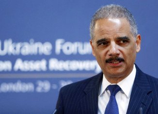 Eric Holder said the US government categorically denounces economic espionage as a trade tactic