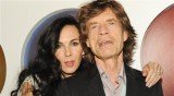 Mick Jagger sang a version of Bob Dylan's Just Like a Woman at a memorial service for his partner L'Wren Scott