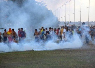 Riot police fired tear gas at anti-World Cup and indigenous demonstrators in Brasilia