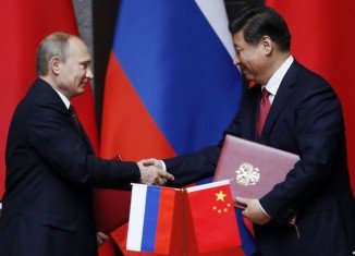 Russian President Vladimir Putin has signed a huge gas supply contract with China during his visit to the Asian country