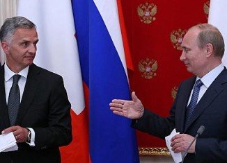 Vladimir Putin met Didier Burkhalter, the Swiss president and current chairman of the OSCE, in Moscow