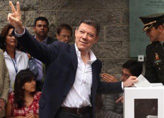 Juan Manuel Santos has been re-elected as Colombia's president in the most dramatic presidential contest in years