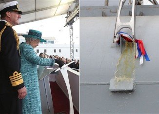 HMS Queen Elizabeth has been named with a bottle of whisky smashed on the hull of the 65,000-tonne vessel