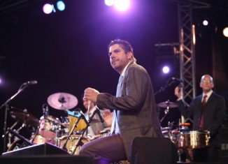 Derek Rieth played many percussion instruments for Pink Martini, including bongos, congas, cymbals, and the triangle