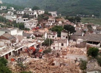 The 6.1-magnitude quake struck a mountainous area, destroying thousands of houses and triggering landslides