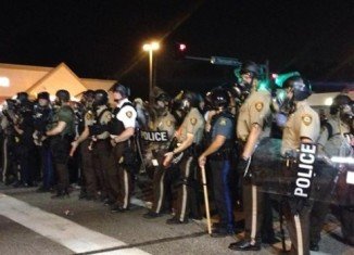 Thirty one people have been arrested in Ferguson, Missouri, during another night of angry protests