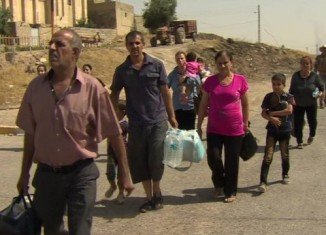 Up to a quarter of Iraq's Christians are reported to be fleeing after Islamic militants seized Qaraqosh