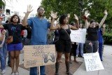 Vigils have been held across the US in honor of Michael Brown, the black teenager killed by police in Missouri