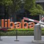 Alibaba flotation: Shares surge in biggest-ever IPO