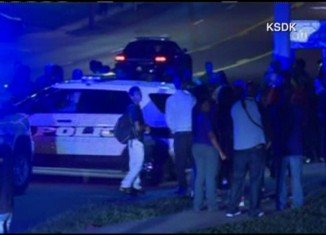 The officer was shot in the arm, according to local broadcaster KSDK, but the circumstances are not known