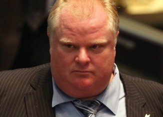 Toronto Mayor Rob Ford has been hospitalized with a tentative diagnosis of a tumor after suffering months of abdominal pain