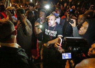 Angry crowds on Shaw streets after an off-duty police officer fatally shot a black teenager