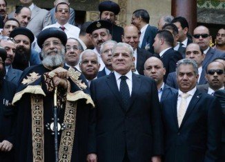 Egypt’s PM Ibrahim Mahlab and Pope Tawadros II attended the opening ceremony at the Coptic Christian Church in Cairo