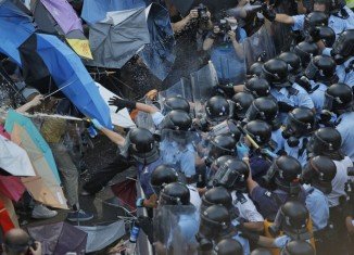 Hong Kong protesters have retaken streets in the Mong Kok district cleared by the authorities just a few hours earlier