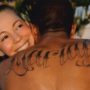 Nick Cannon covers up Mariah Carey tattoo on his back