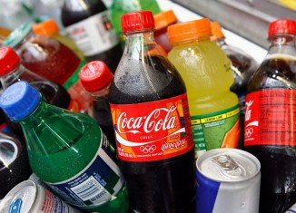 Signs warning shoppers how much exercise they need to do to burn off calories in sugary drinks can encourage healthier choices