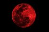 The Moon appears orange or red, the result of sunlight scattering off our atmosphere, hence the name Blood Moon