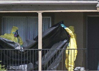 The flat in Dallas where Thomas Eric Duncan lived before being isolated is being cleaned by hazardous materials specialists