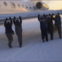 Katekavia passengers push frozen plane in Siberia