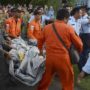AirAsia plane crash: First bodies arrive in Surabaya