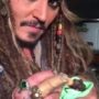Johnny Depp Bottle Feeding Baby Bat in Australia