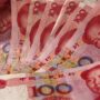Chinese Yuan Devalued at Three-Year Low